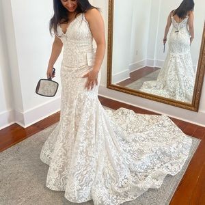 This is an Allure Bridals wedding dress. It is white with cream undertone size 8